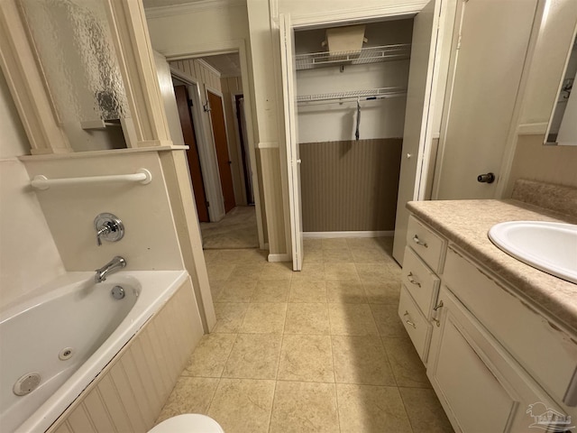 bathroom featuring vanity, a tub, and tile patterned floors