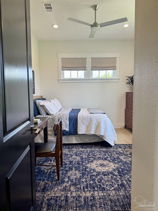1557 Winding Shore Dr, Gulf Breeze, FL 32563 - bedroom featuring wood finished floors, ceiling fan, and recessed lighting