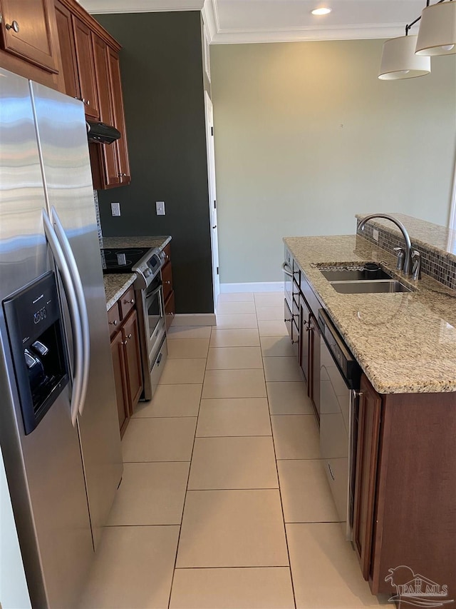 kitchen with sink, appliances with stainless steel finishes, light stone counters, ornamental molding, and light tile patterned flooring