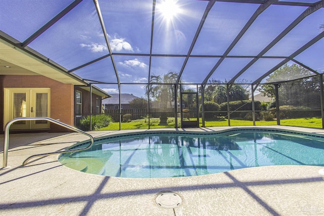 view of pool featuring a patio area and glass enclosure