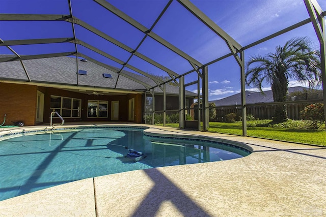 view of pool featuring ceiling fan, a lanai, and a patio