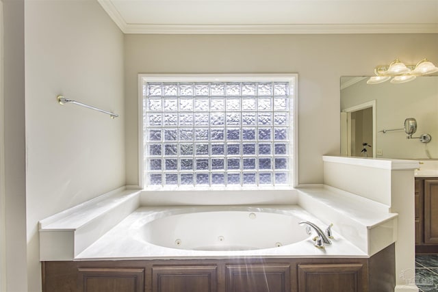 bathroom featuring ornamental molding, a tub to relax in, and vanity