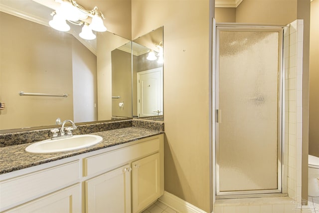 bathroom featuring vanity, ornamental molding, a shower with shower door, tile patterned floors, and toilet