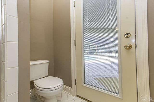 bathroom with tile patterned floors and toilet