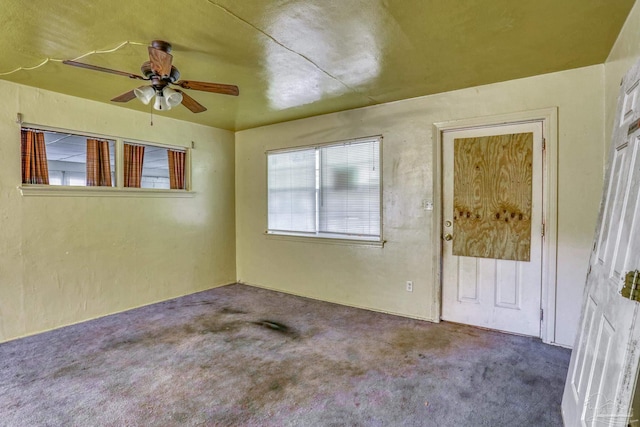 carpeted empty room with ceiling fan