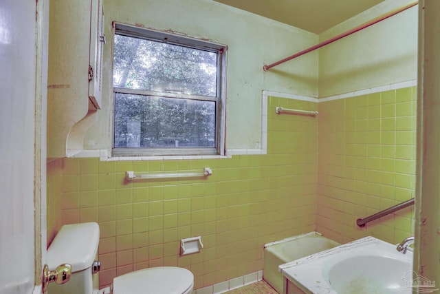 full bathroom featuring toilet, sink, tile walls, and independent shower and bath