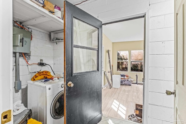 washroom with washer / dryer and hardwood / wood-style floors