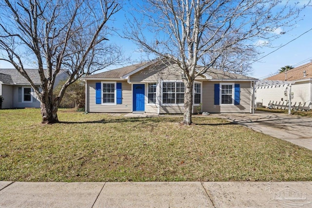 ranch-style home with a front lawn