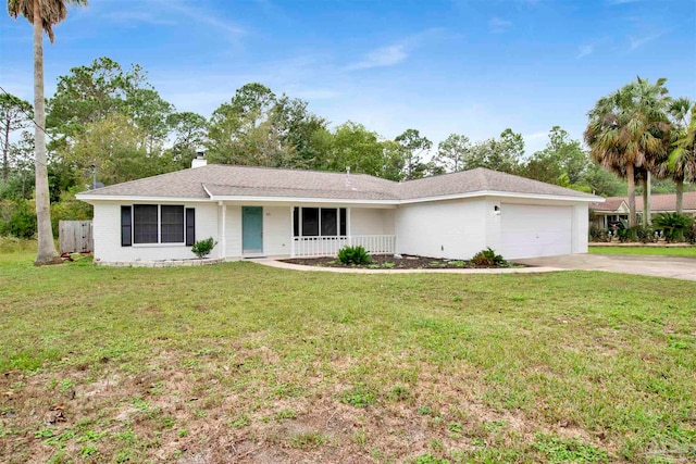 single story home with covered porch, a garage, and a front lawn