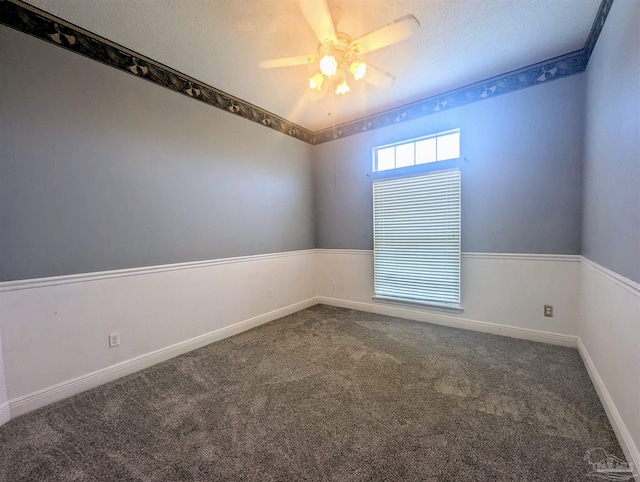 carpeted empty room with a textured ceiling and ceiling fan