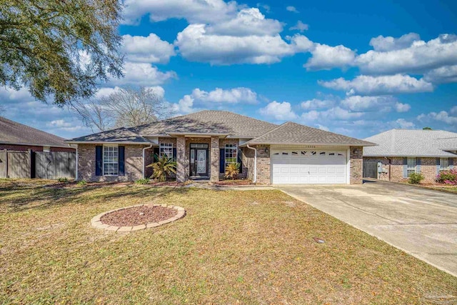 ranch-style house featuring brick siding, fence, a front yard, driveway, and an attached garage