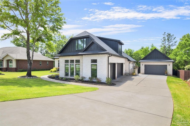 8780 Spider Lily Way, Pensacola, FL 32526 - view of front of home with board and batten siding, a front yard, brick siding, concrete driveway, and an attached garage