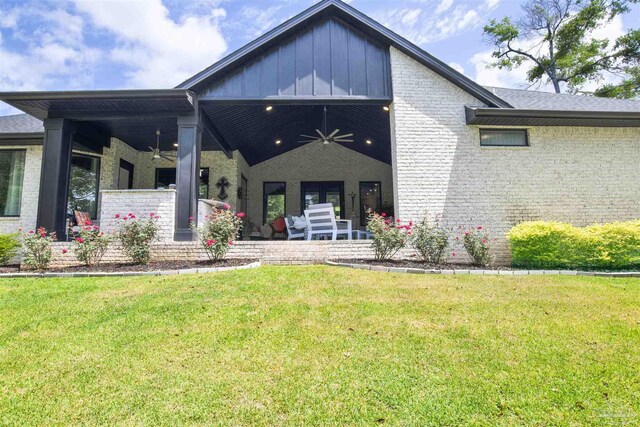 8780 Spider Lily Way, Pensacola, FL 32526 - view of front of home featuring board and batten siding, ceiling fan, brick siding, and a front yard