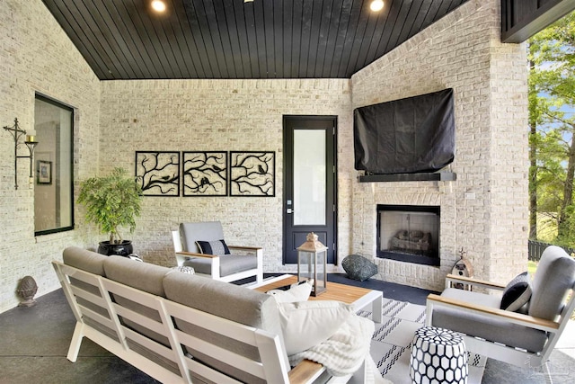 8780 Spider Lily Way, Pensacola, FL 32526 - living area featuring wooden ceiling, an outdoor fireplace, vaulted ceiling, and recessed lighting