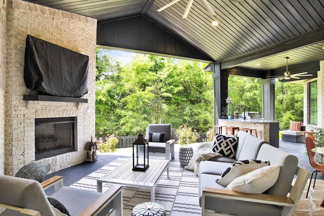 8780 Spider Lily Way, Pensacola, FL 32526 - view of patio / terrace featuring ceiling fan and an outdoor living space with a fireplace