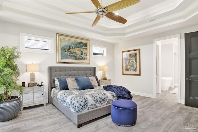 8780 Spider Lily Way, Pensacola, FL 32526 - bedroom featuring light wood-type flooring, ornamental molding, a raised ceiling, and visible vents