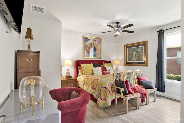 8780 Spider Lily Way, Pensacola, FL 32526 - bedroom with ceiling fan, baseboards, visible vents, and wood finished floors