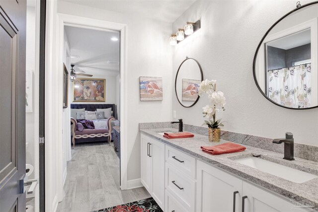 8780 Spider Lily Way, Pensacola, FL 32526 - full bath with a sink, a ceiling fan, double vanity, and wood finished floors