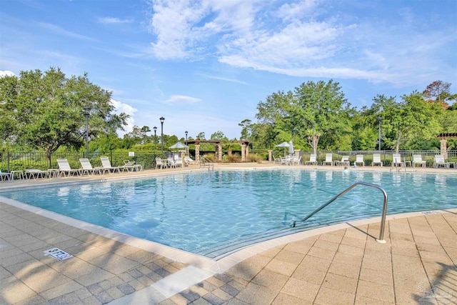 8780 Spider Lily Way, Pensacola, FL 32526 - pool with fence and a patio area