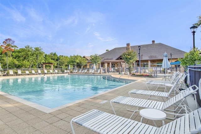 8780 Spider Lily Way, Pensacola, FL 32526 - pool with a patio area and fence