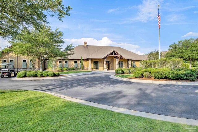 8780 Spider Lily Way, Pensacola, FL 32526 - ranch-style house with a front lawn and a chimney