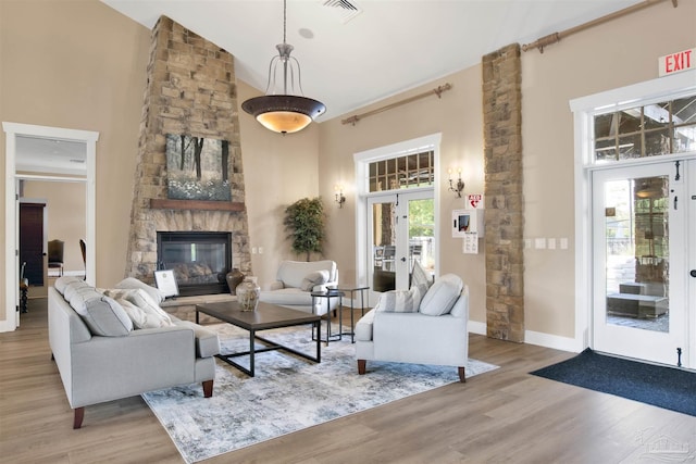8780 Spider Lily Way, Pensacola, FL 32526 - living room featuring a high ceiling, visible vents, french doors, and wood finished floors