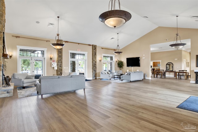 8780 Spider Lily Way, Pensacola, FL 32526 - living area with light wood-style floors, high vaulted ceiling, french doors, baseboards, and visible vents