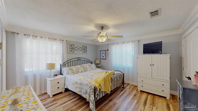 200 Talladega Trl, Pensacola, FL 32506 - bedroom with light wood-type flooring, crown molding, and ceiling fan