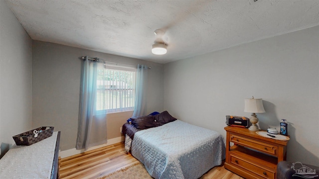 200 Talladega Trl, Pensacola, FL 32506 - bedroom with light wood-type flooring, baseboards, and a ceiling fan