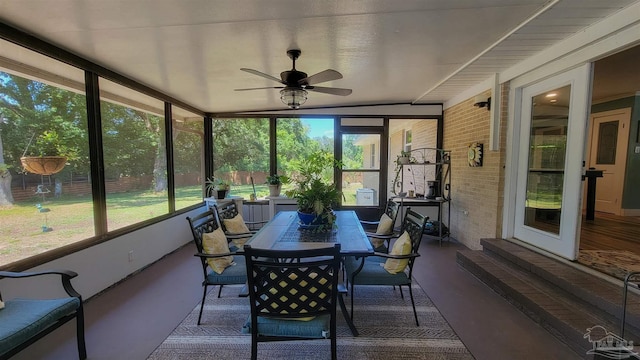 200 Talladega Trl, Pensacola, FL 32506 - sunroom featuring a ceiling fan, outdoor dining area, and entry steps