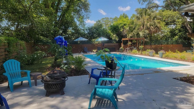 200 Talladega Trl, Pensacola, FL 32506 - view of swimming pool featuring an outdoor fire pit, a fenced backyard, and a patio