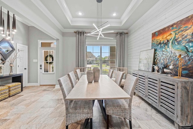 1397 Sabal Palm Dr, Gulf Breeze, FL 32563 - dining area featuring wooden walls, a tray ceiling, an inviting chandelier, and ornamental molding
