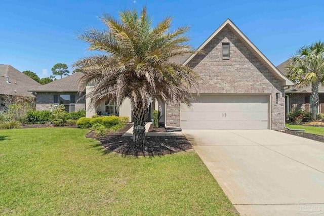1397 Sabal Palm Dr, Gulf Breeze, FL 32563 - view of front of property featuring an attached garage, concrete driveway, and brick siding