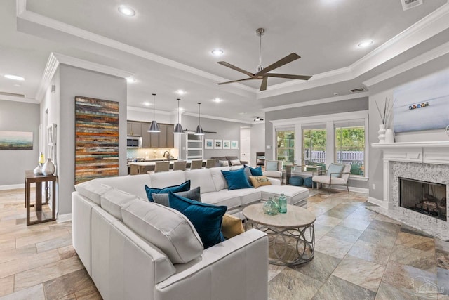 1397 Sabal Palm Dr, Gulf Breeze, FL 32563 - living area featuring recessed lighting, a ceiling fan, a raised ceiling, and ornamental molding