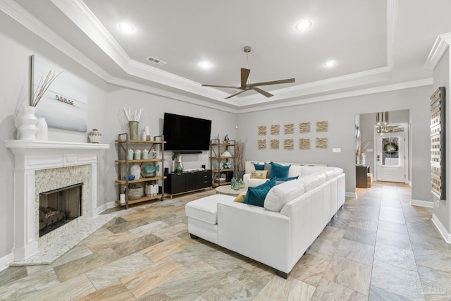 1397 Sabal Palm Dr, Gulf Breeze, FL 32563 - living room featuring visible vents, ornamental molding, a fireplace, a raised ceiling, and a ceiling fan