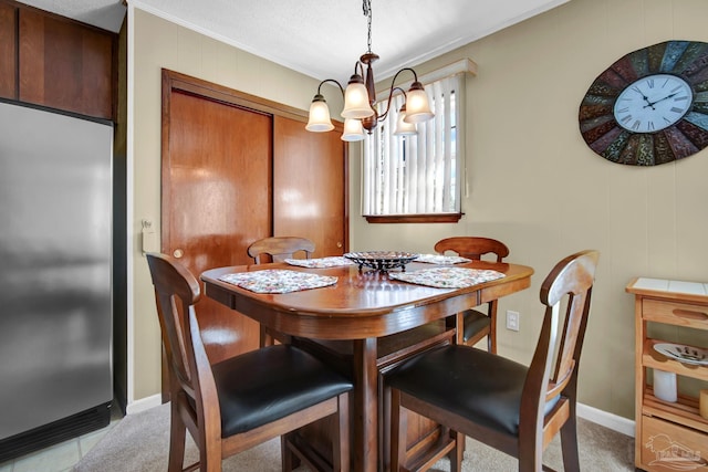 dining area featuring a chandelier and a textured ceiling