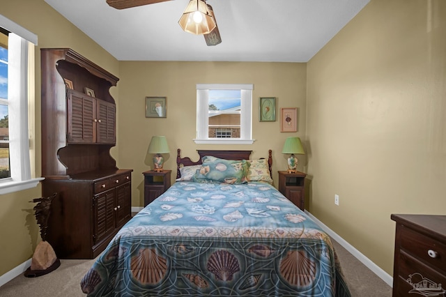 carpeted bedroom with baseboards