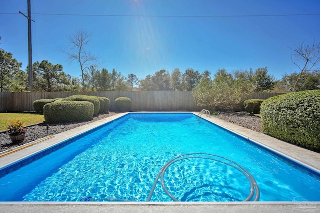 view of swimming pool featuring a fenced backyard and a fenced in pool