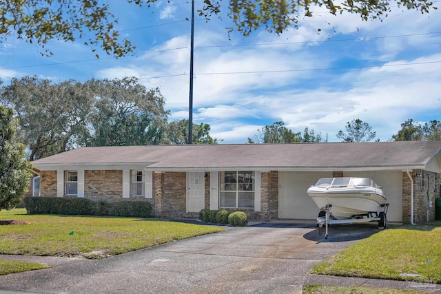 ranch-style home with a garage, brick siding, aphalt driveway, and a front yard