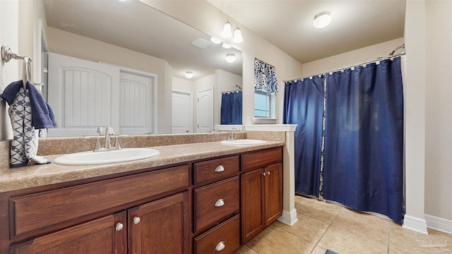 bathroom with tile patterned flooring and vanity