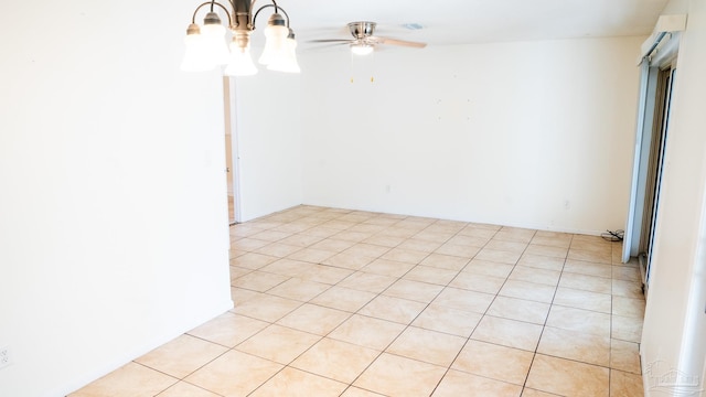 unfurnished room with ceiling fan and light tile patterned flooring