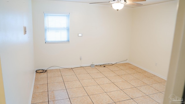 tiled empty room with ceiling fan