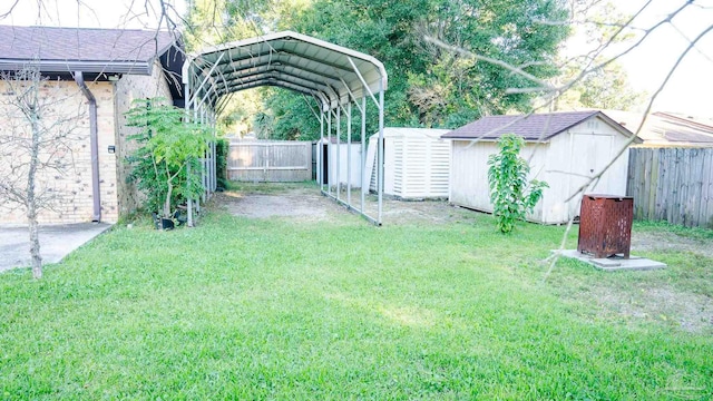 view of yard featuring a shed and a carport