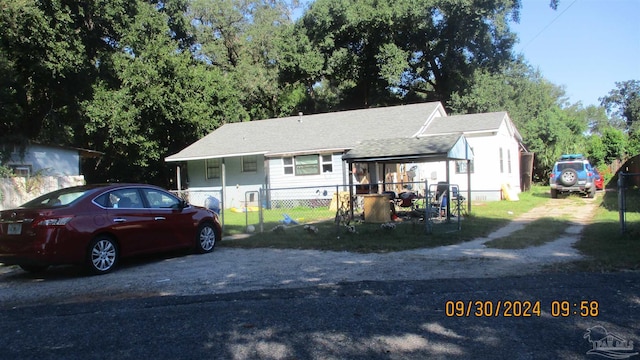 view of front of house with fence