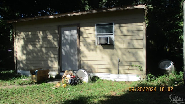 view of side of property featuring an outbuilding