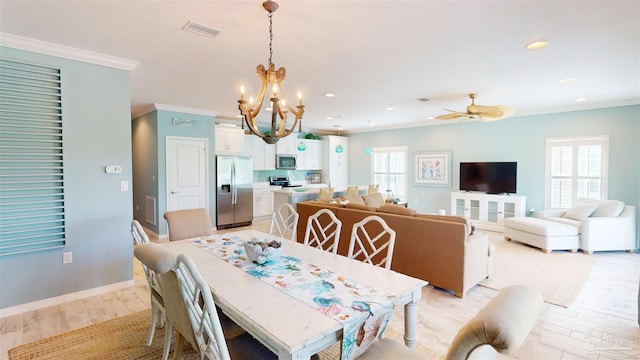 dining room featuring crown molding, recessed lighting, light wood finished floors, and plenty of natural light