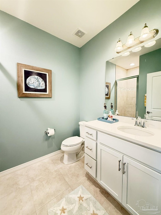 bathroom with visible vents, vanity, toilet, baseboards, and tiled shower