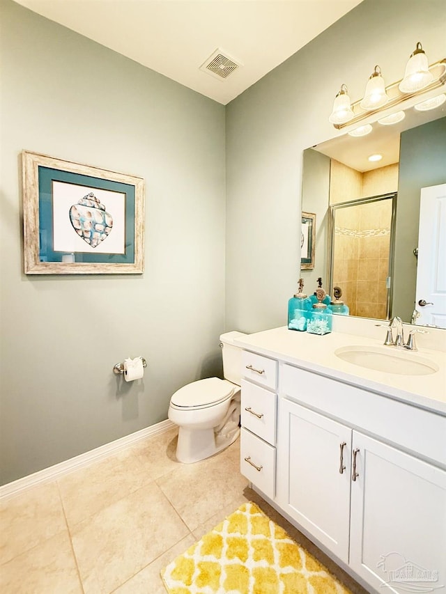 bathroom featuring vanity, toilet, tile patterned floors, visible vents, and a stall shower