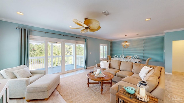 living room featuring visible vents, light wood-type flooring, baseboards, ornamental molding, and recessed lighting