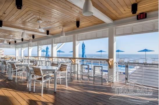 wooden terrace featuring a water view